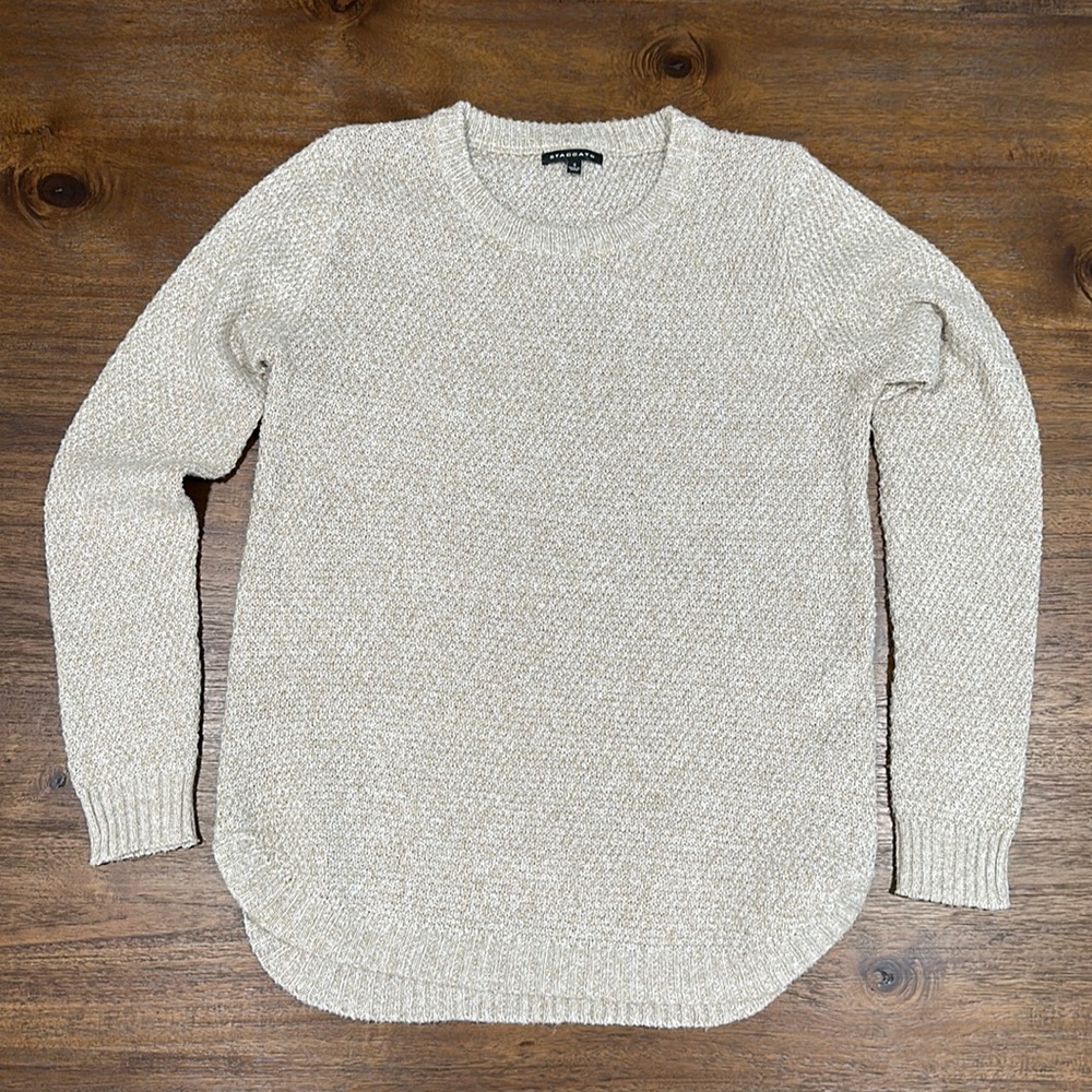 Thin, tan sweater.